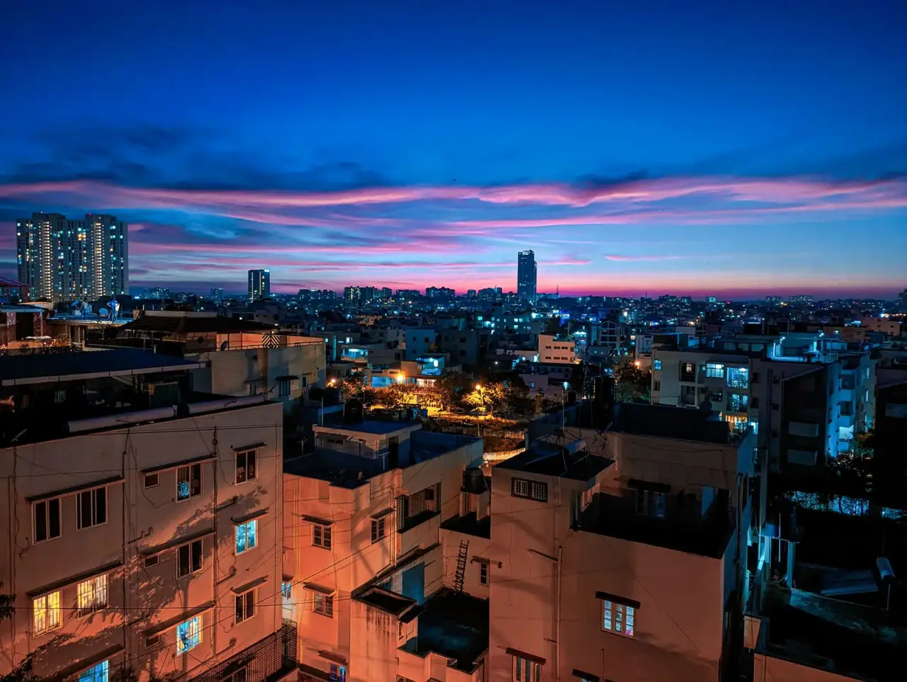 Bengaluru city skyline lit up at dusk
