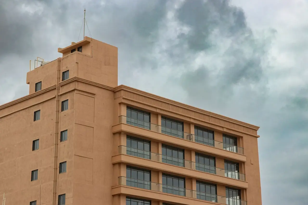 Modern building in Rajkot under a cloudy sky